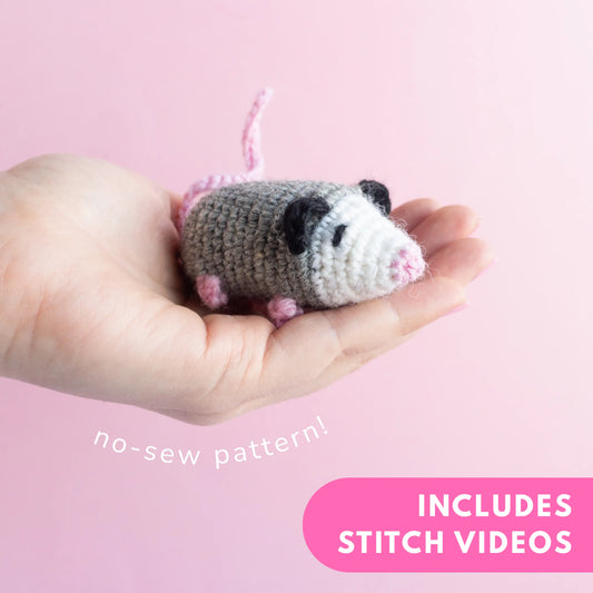 Gray crocheted opossum amigurumi